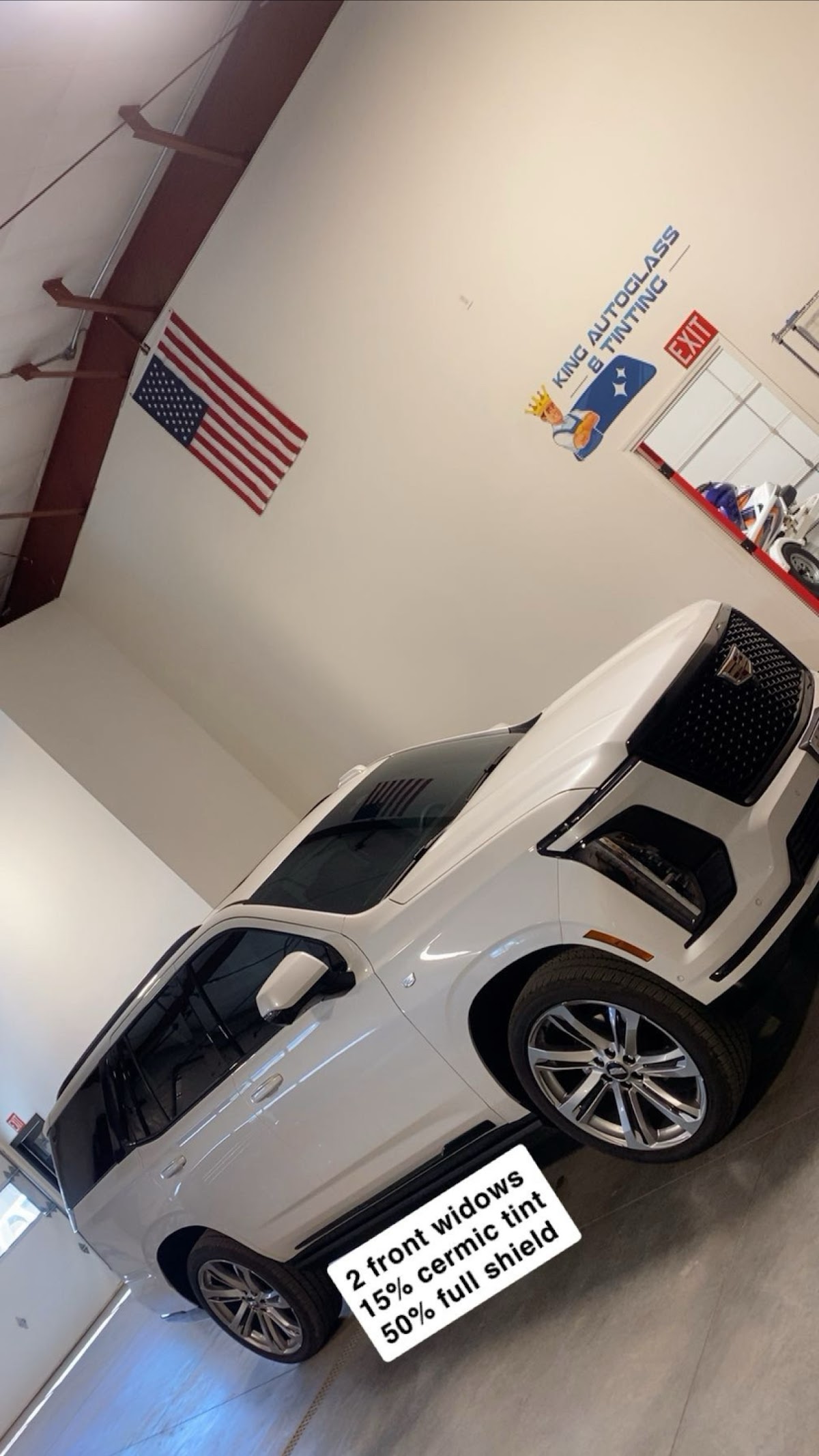 A white SUV getting ceramic tint installed at King Auto Glass and Tinting